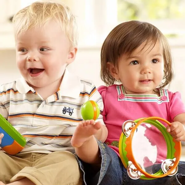 Toddlers playing with percussion instruments